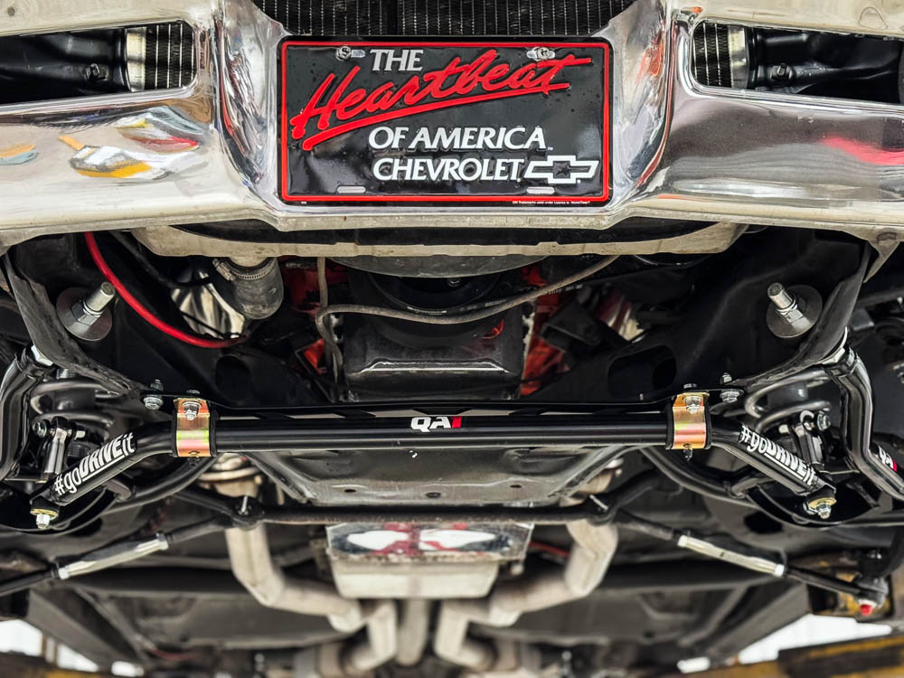 QA1 sway bar and drop spindles in the front suspension, demonstrating the car’s precise handling setup.