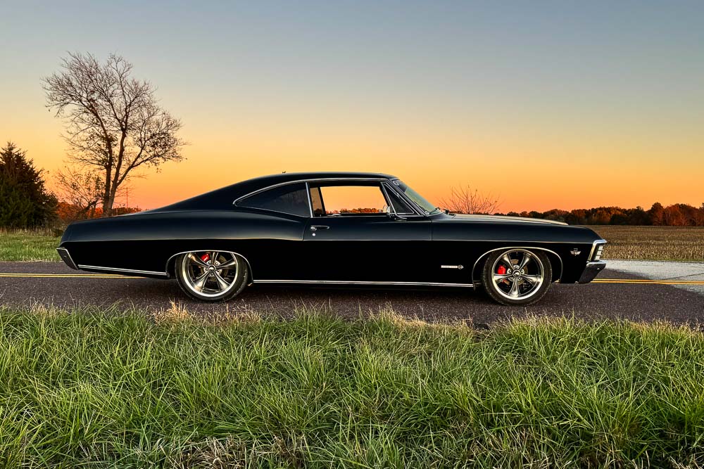 Side profile of the 1967 Impala SS with its lowered stance and 20-inch rear wheels.