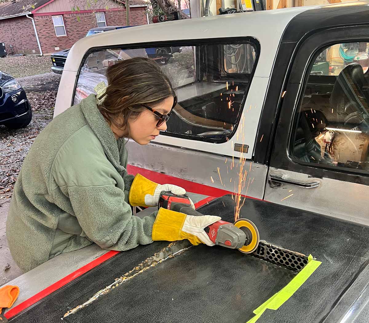 Jamie Murphy grinding on a part during the Blahvette build, capturing the DIY nature of the project.