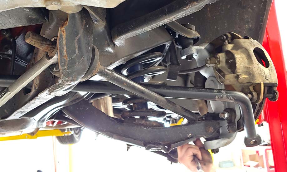 Chevy Impala equipped with adjustable coil-over shocks, allowing for customized compression and rebound settings.